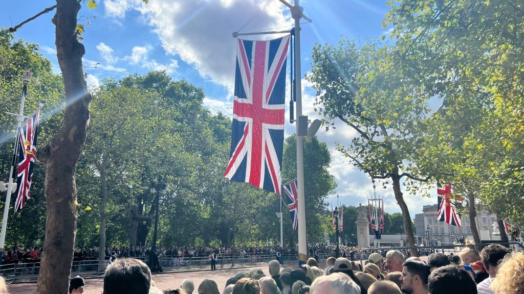 Crowds await the Queen's coffin procession