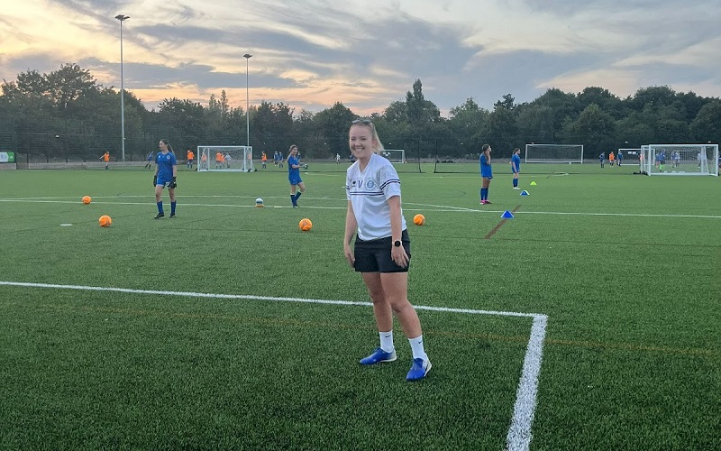 A coach at Hitchin Belles on the field