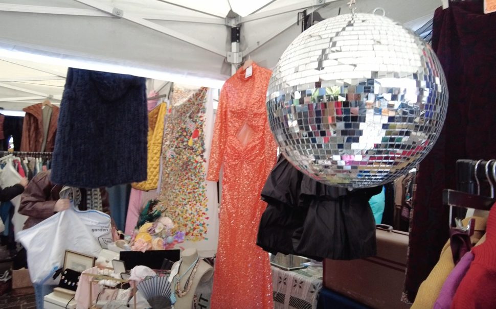 A vintage stall at the classic car boot sale with a disco ball.