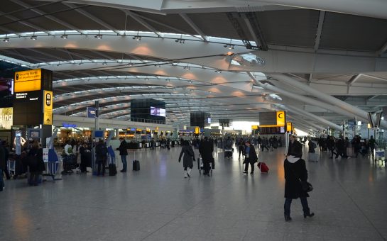 Heathrow Airport arrivals area with passengers
