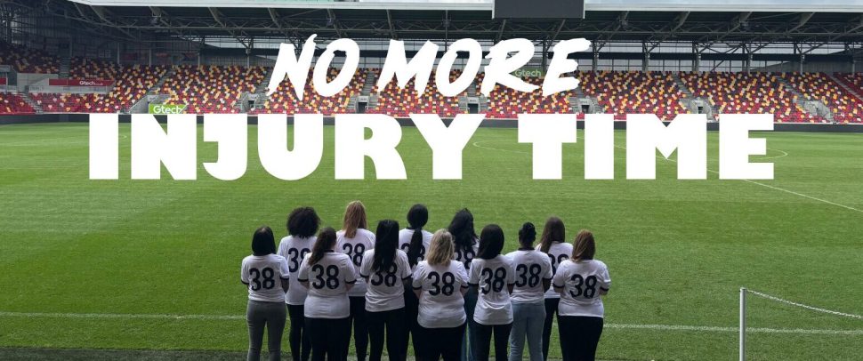 Image of the 'no more injury time' campaign by Solace showing women on the football pitch in the newly designed shirt.