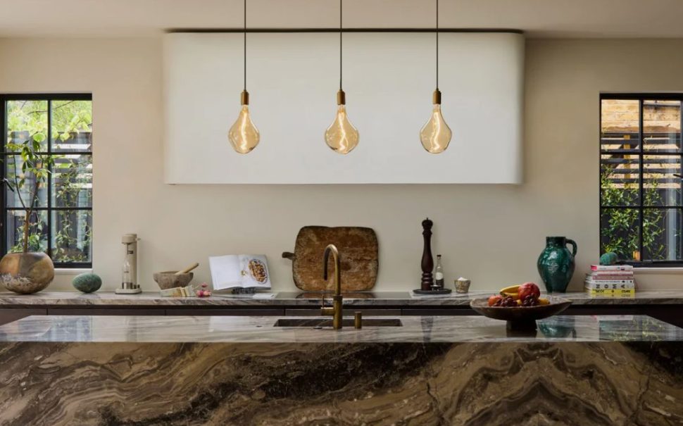 Three light bulbs hanging in kitchen