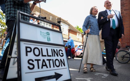 Ed Davey and his wife outside a polling station