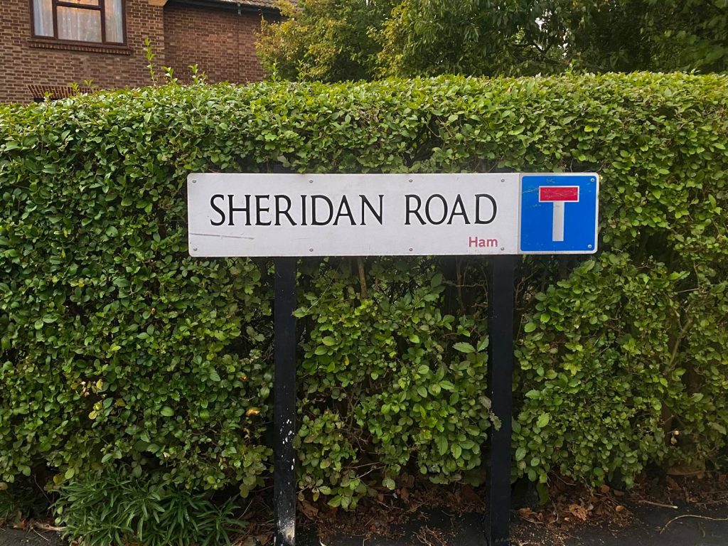 The street sign at the entrance to Sheridan Road.