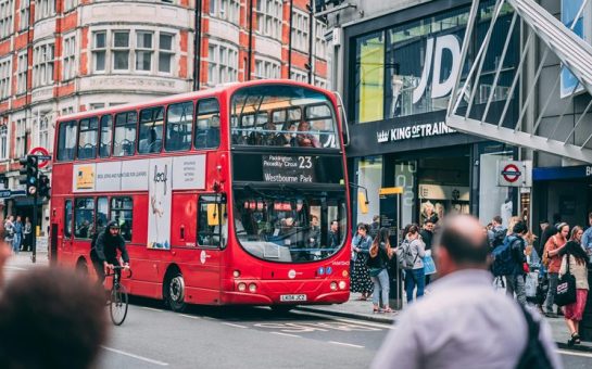 image of double decker bus on oxford road next to the JD trainers store