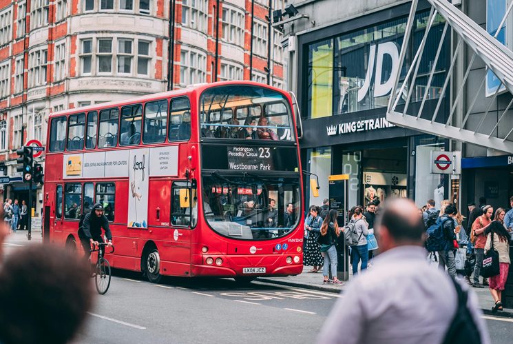 image of double decker bus on oxford road next to the JD trainers store