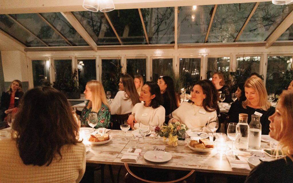 People listening to a speaker at SW London Women's supper club event at HOMESW15