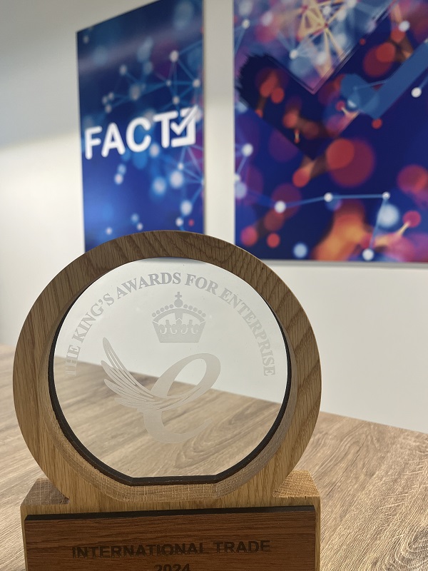 The King's Award - circular glass surrounded by a light wood in a circle