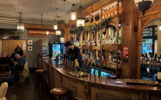 The inside of a largely empty pub