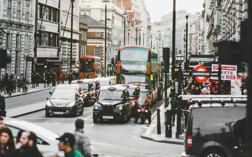 A London street with cars waiting.