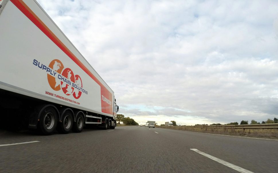 A truck driving down a motorway