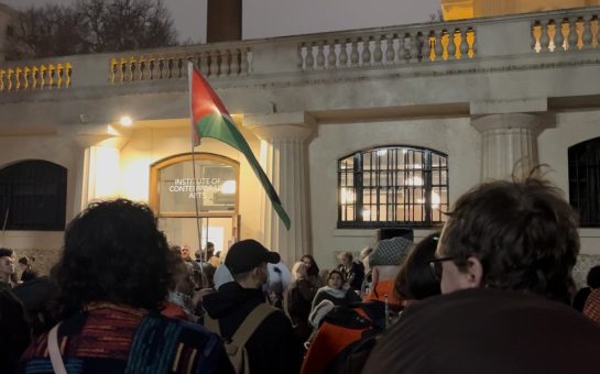 Images show a crowd stood outside the Institute of Contemporary art in Central London. A person holds a Palestinian flag in the background.