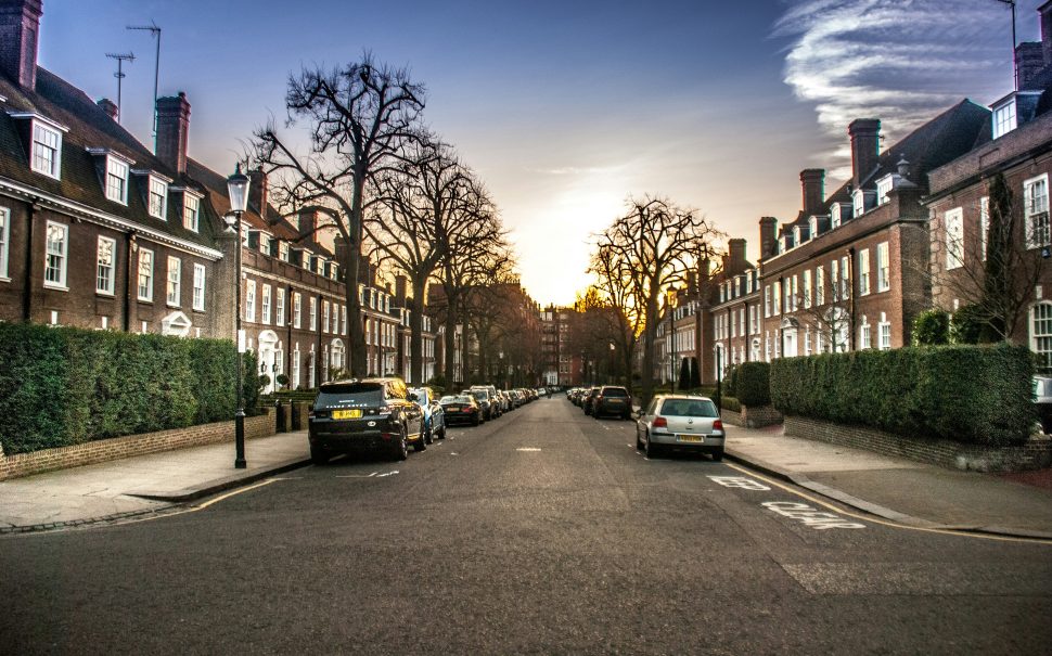 Image of street of terraced houses with cars parked