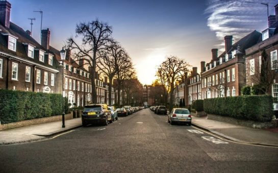 Image of street of terraced houses with cars parked