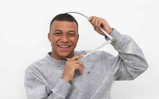 Kylian Mbappé posing for Madame Tussauds