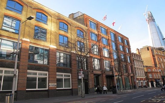 Photo taken from across street of Southwark Council offices in daylight. The Shard can be seen in the background, to the top right.