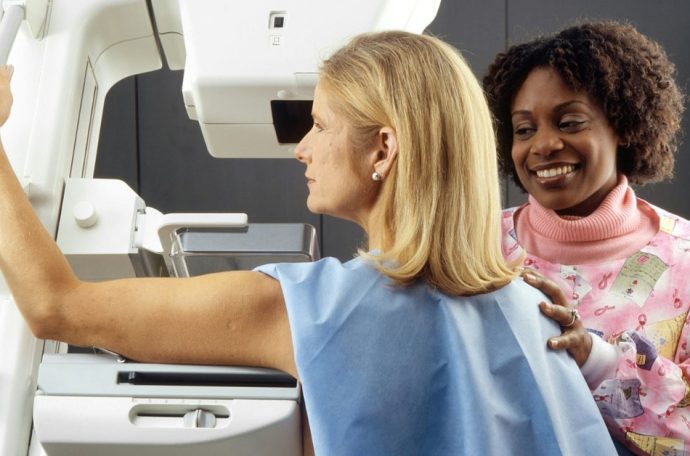 Woman having a mammogram scan done